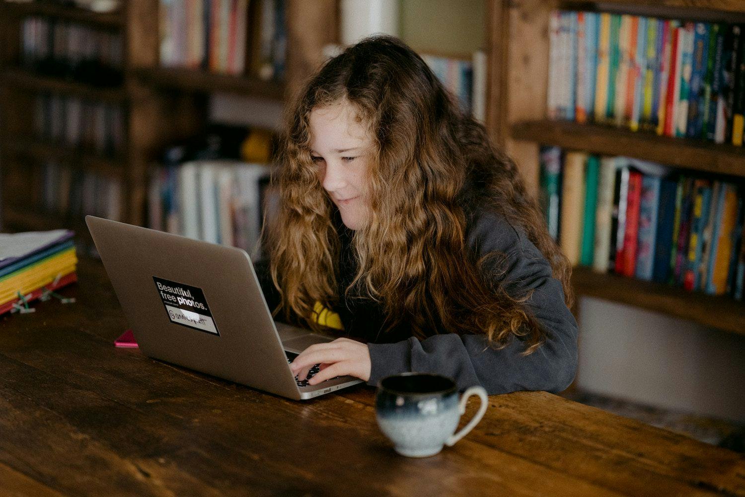 Girl sitting at laptop