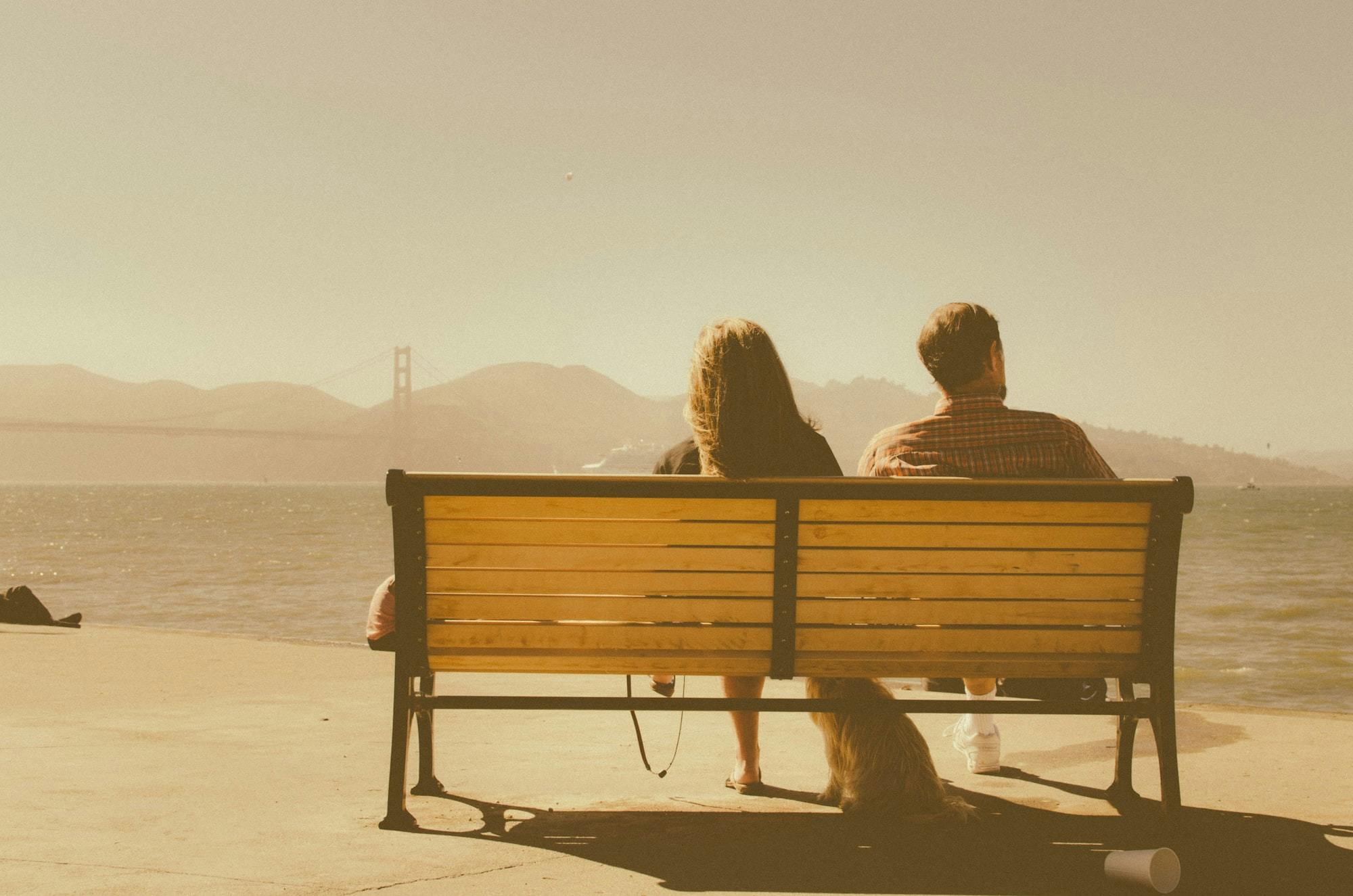 Couple on bench looking away from each other