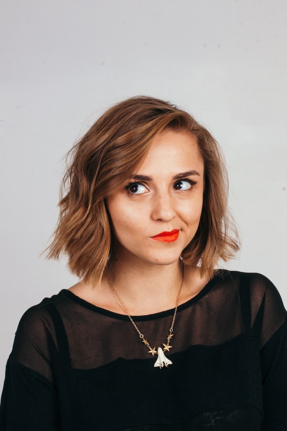 This is a photo of Hannah looking off to the side playfully