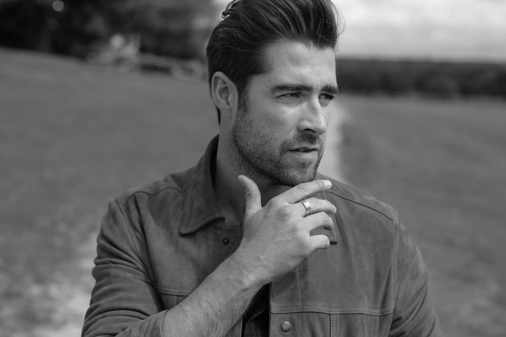 This is a photo of Matt in black and white looking to the side