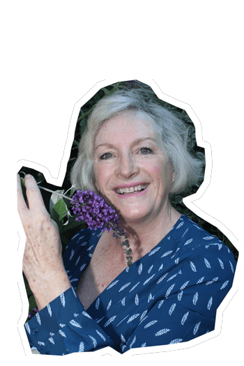 Yvonne, happiful reader in her garden with flowers