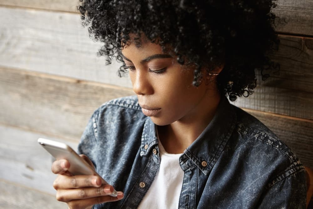 Woman glued to her phone
