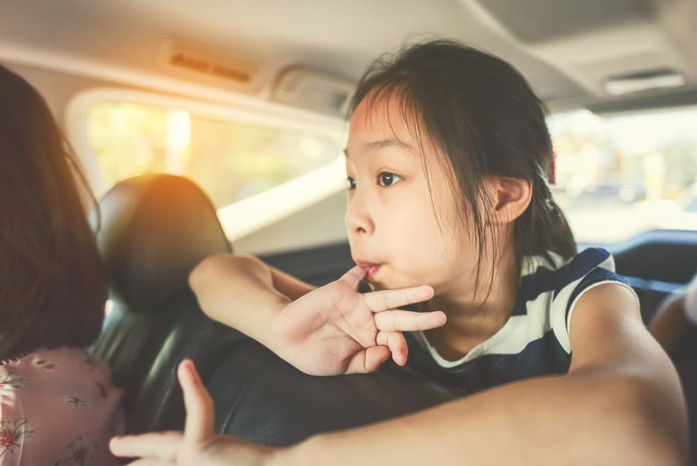 child worried in car