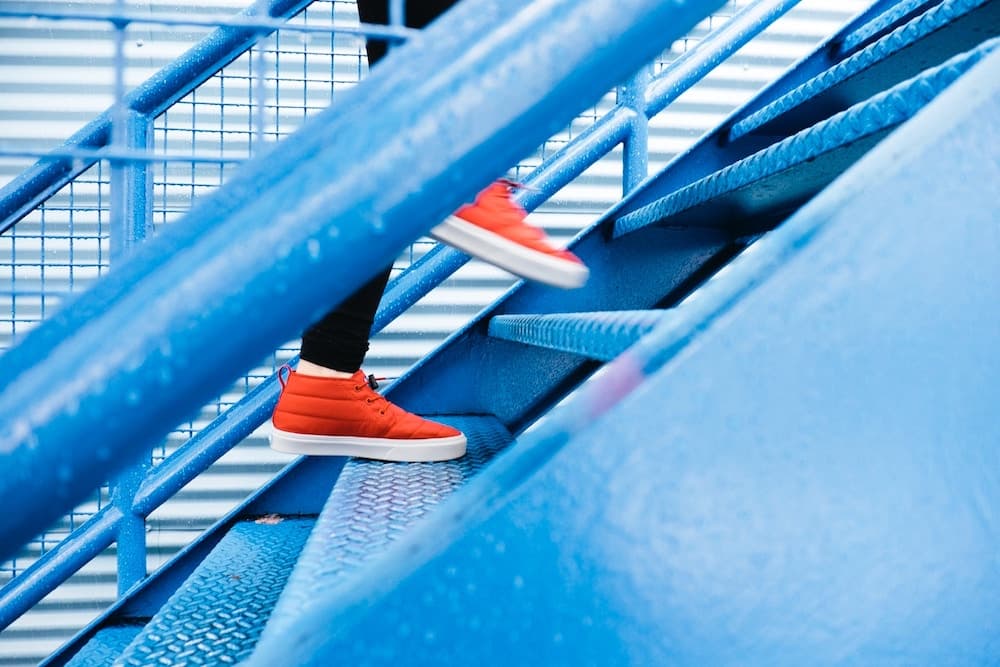 woman running up stairs