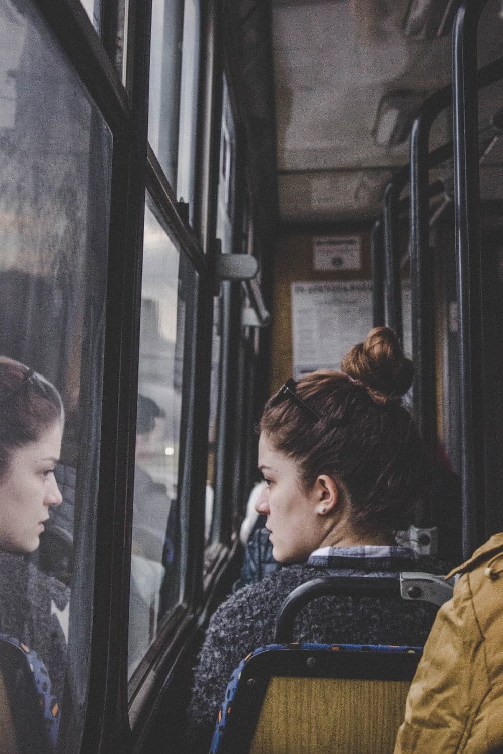 woman looking out window