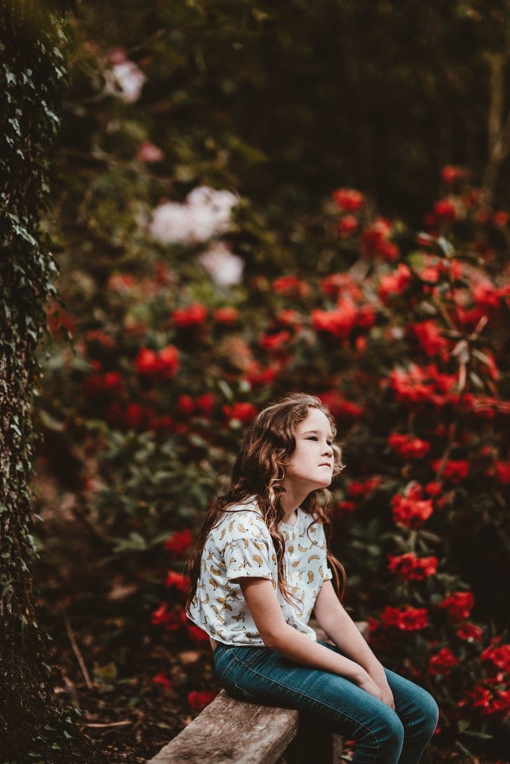 girl sat on bench