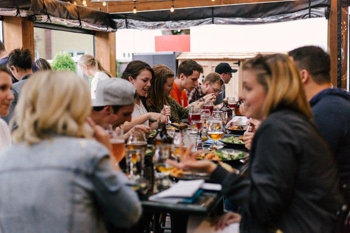 Image-of-a-group-of-friends-sat-in-a-restaurant-laughing