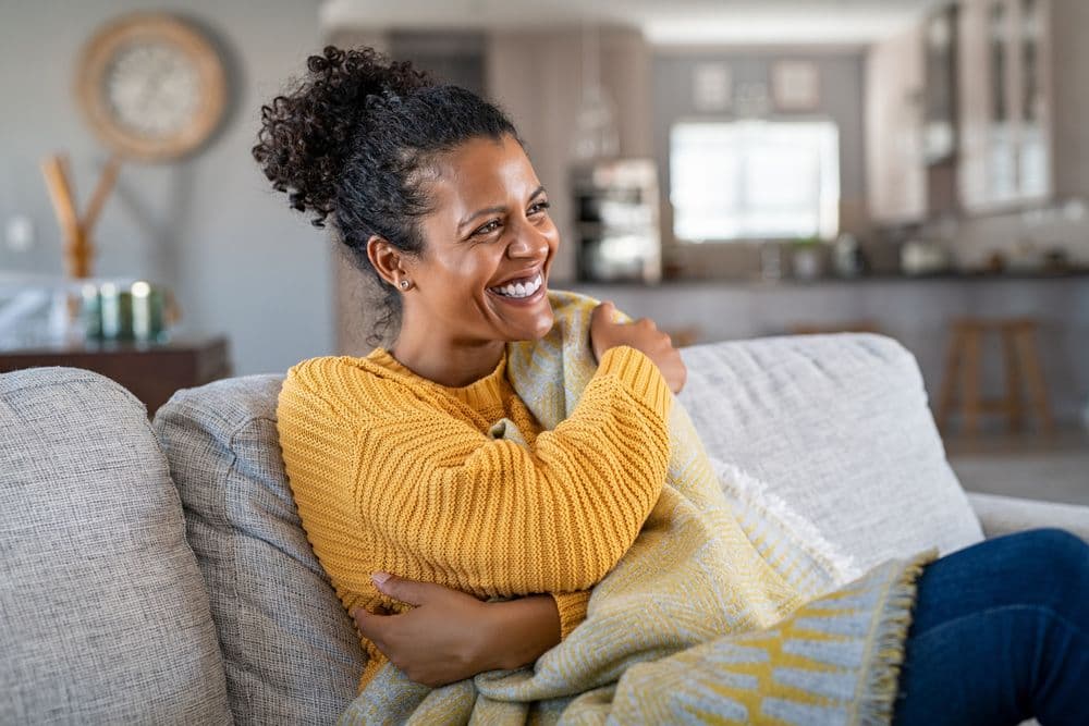 woman sitting on sofa