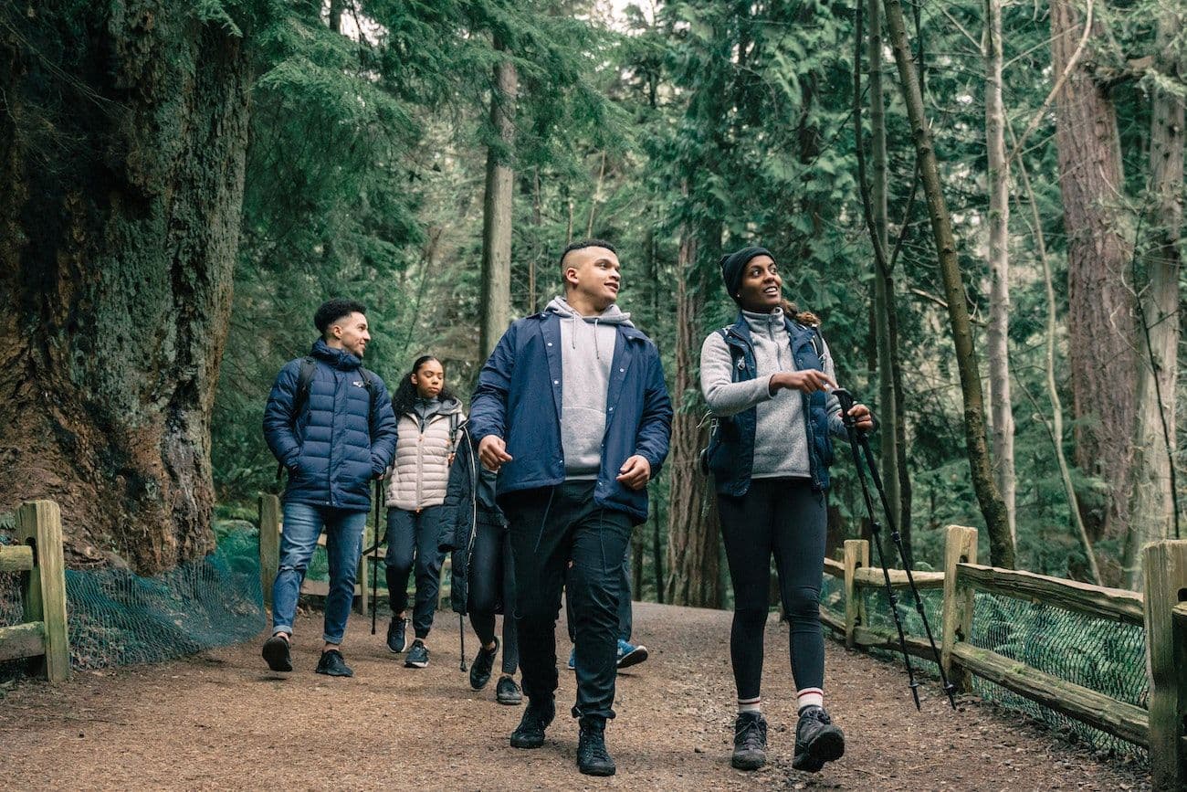 Group of friends hiking in the woods