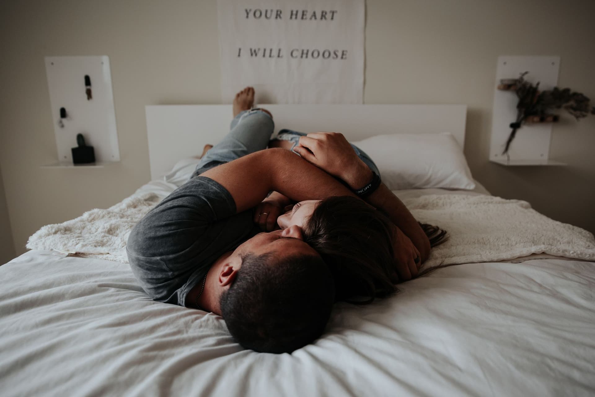 Couple hugging in bed