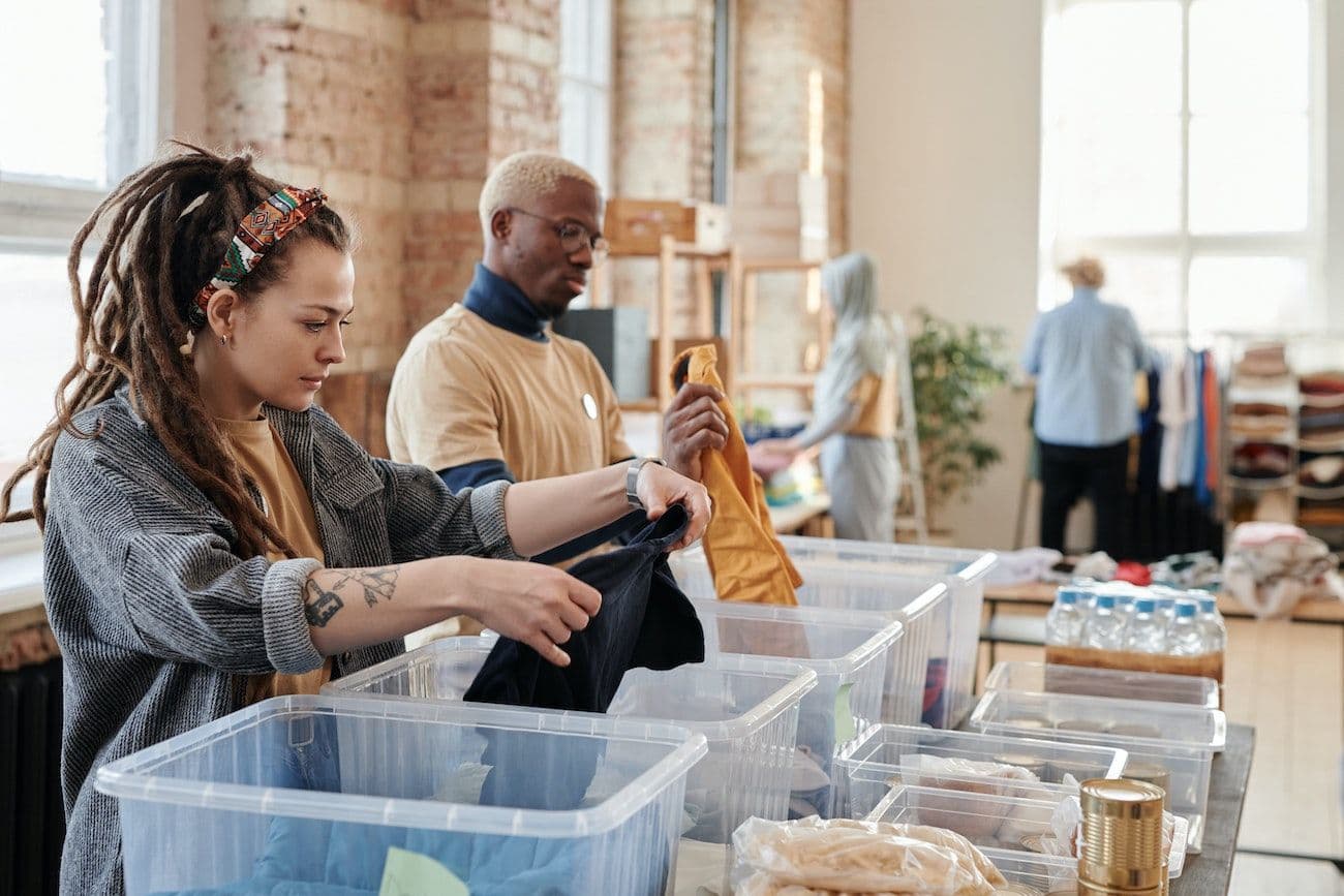Volunteers sorting through clothes