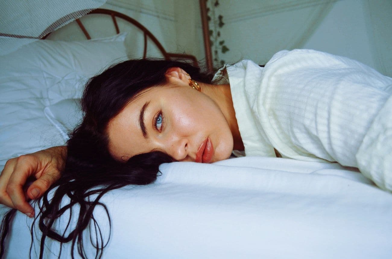 Woman lying in bed