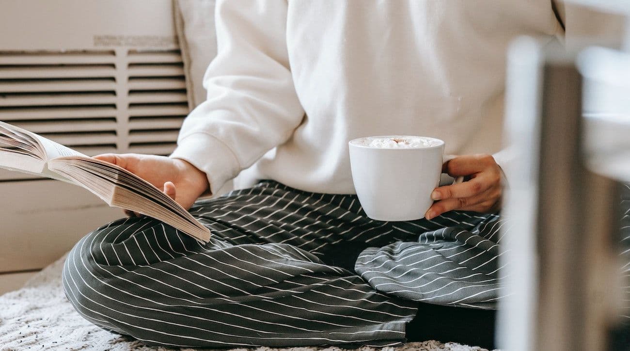 Person reading with coffee