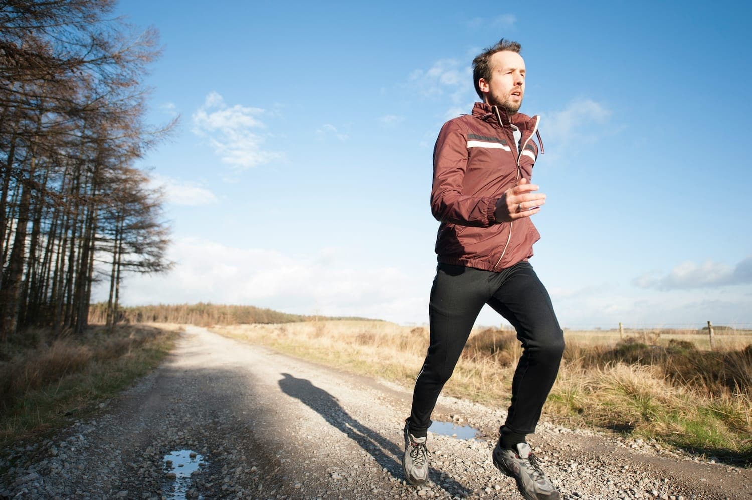 Image shows man on a run outdoors.